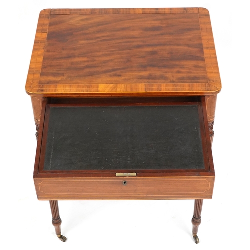 1002 - A good late George III figured mahogany and rosewood crossbanded work table, the lift up back above ... 