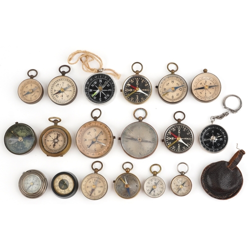 A collection of naval interest compasses, the largest 4.4cm in diameter.
