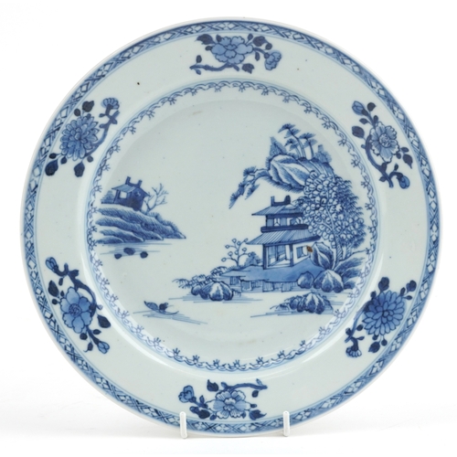 124 - A Chinese blue and white porcelain plate hand painted with pavilions, bearing a Christies' Nanking C... 