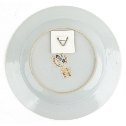 124 - A Chinese blue and white porcelain plate hand painted with pavilions, bearing a Christies' Nanking C... 