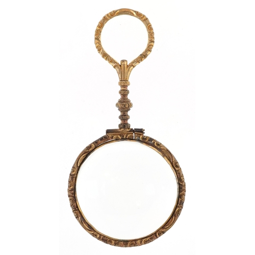 56 - A 19th century gold plated magnifying glass, 11cm in length.