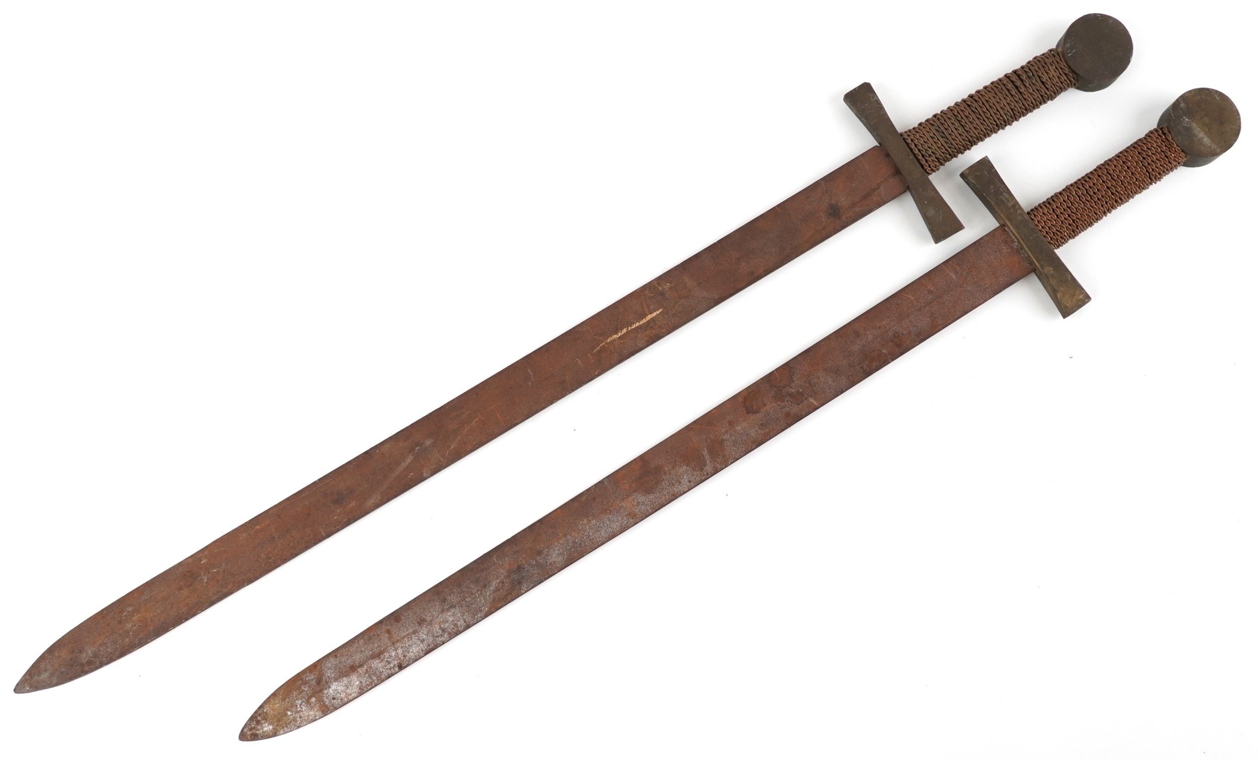 Two medieval style swords with copper bound grips and bronze mounts ...