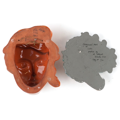 26 - Two Art Deco pottery wall masks in the manner of Goldscheider including a Keramos example, the large... 