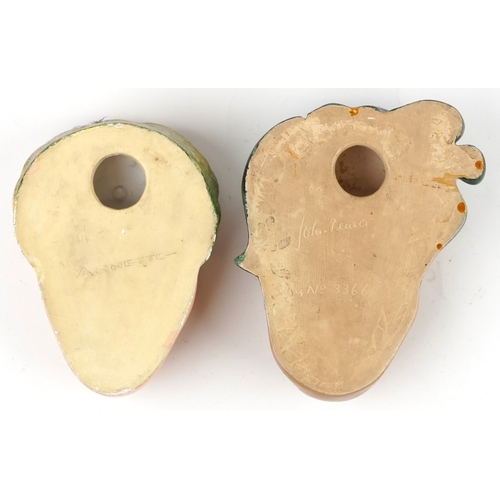 27 - Two Art Deco pottery female wall masks, one by Leonardene Co., the largest 26cm high.