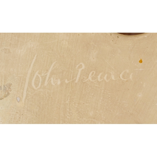 27 - Two Art Deco pottery female wall masks, one by Leonardene Co., the largest 26cm high.