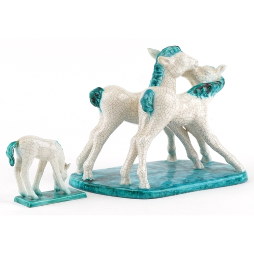 21 - A Goldscheider Art Deco pottery figure group of two foals together with a smaller study of a horse, ... 