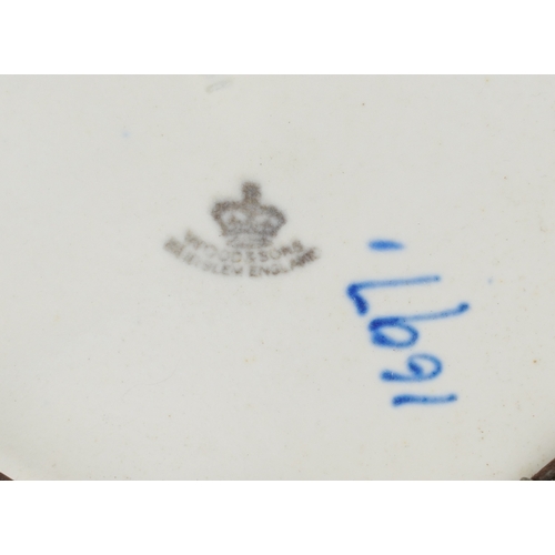 278 - Charlotte Rhead for Wood & Sons, an Art Deco pottery charger hand painted with stylized flowers, num... 