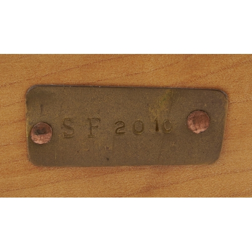 1 - Sam Fanaroff, an Arts & Crafts style copper shield vase having a green stone cabochon, raised on a l... 