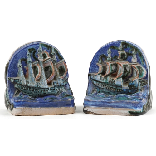 140 - A pair of Art Deco style stoneware bookends modelled as galleons, possibly Compton, 14cm high.