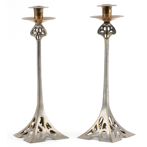 16 - A pair of Art Nouveau style silvered candlesticks, 37cm high.