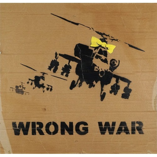 1214 - BANKSY (B. 1974) - Yellow Chopper, Wrong War, Modern British School, spray paint stencil on cardboar... 