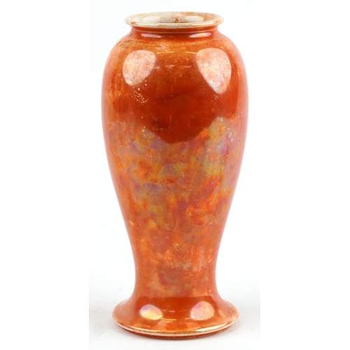 143 - A Ruskin pottery orange lustre glazed baluster vase, 27.5cm high.