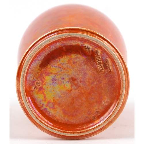 143 - A Ruskin pottery orange lustre glazed baluster vase, 27.5cm high.