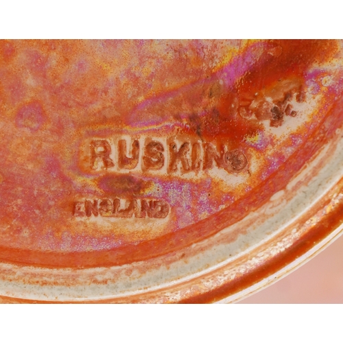 143 - A Ruskin pottery orange lustre glazed baluster vase, 27.5cm high.