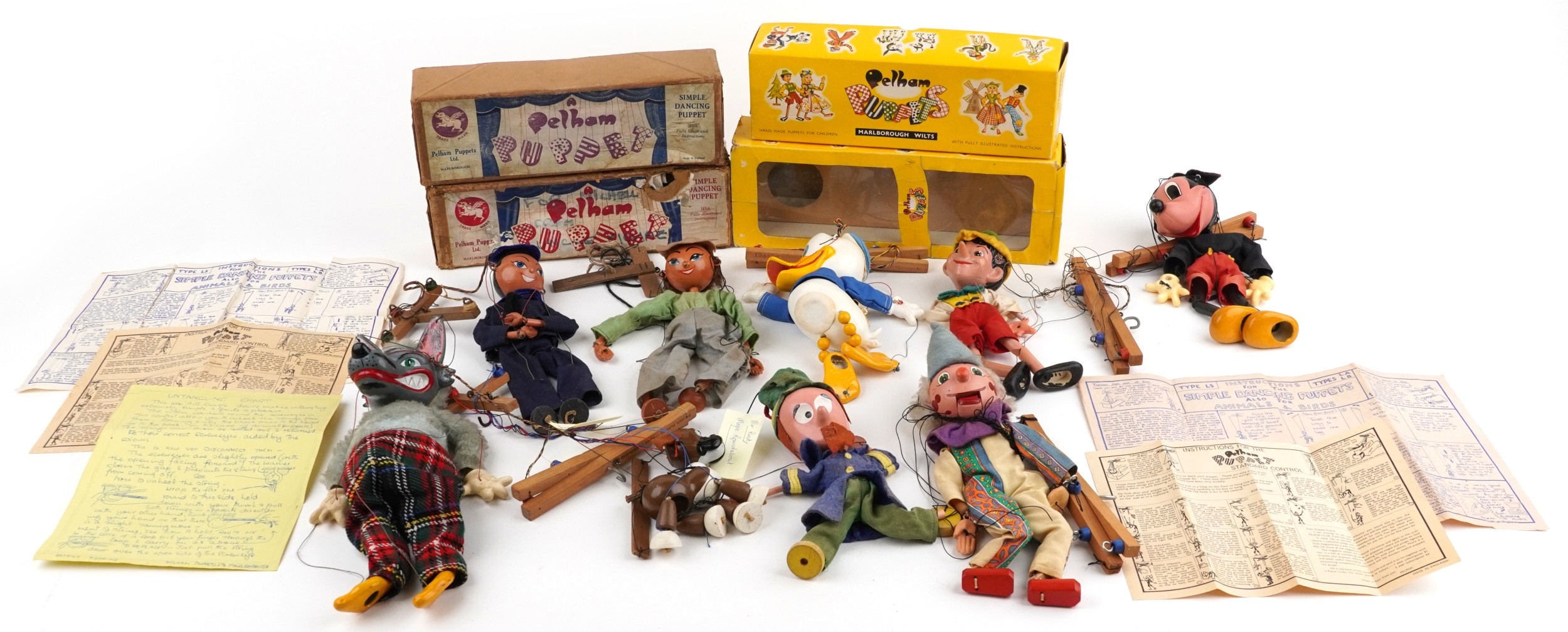 Seven Pelham puppets including Donald Duck, Pinocchio and a sailor ...