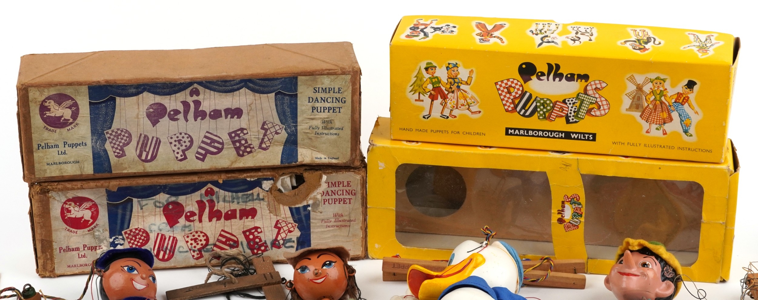 Seven Pelham puppets including Donald Duck, Pinocchio and a sailor ...