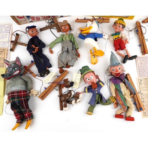 Seven Pelham puppets including Donald Duck, Pinocchio and a sailor ...