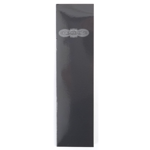 59 - A Parker Duofold red marbleised fountain pen having 18ct gold nib, with box, 13.5cm in length.