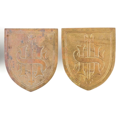 54 - Four ecclesiastical brass shield plaques/mounts including one engraved IHS, the largest 10cm high.