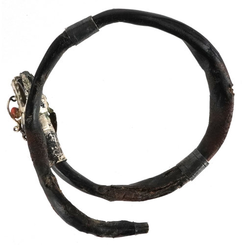 138 - An antique Chinese silver mounted gnarled wood bangle in the form of a dragon with coral eyes, 7.5cm... 