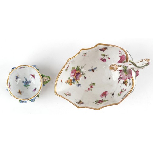 35 - A 19th century Meissen German porcelain floral encrusted tea cup together with a strawberry leaf sau... 