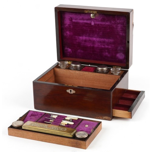 47 - An early 19th century rosewood workbox with fitted interior, glass jars and secret drawer, the hinge... 