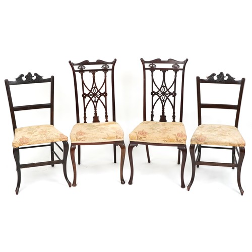 1007 - An Edwardian mahogany four piece salon suite, with carved and pierced backs, raised on cabriole legs... 