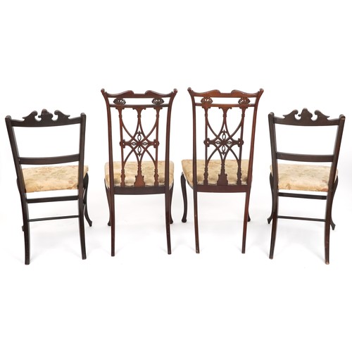 1007 - An Edwardian mahogany four piece salon suite, with carved and pierced backs, raised on cabriole legs... 