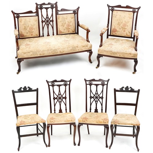 1007 - An Edwardian mahogany four piece salon suite, with carved and pierced backs, raised on cabriole legs... 
