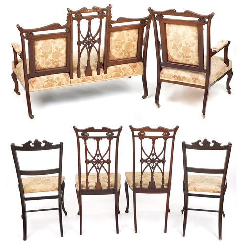 1007 - An Edwardian mahogany four piece salon suite, with carved and pierced backs, raised on cabriole legs... 