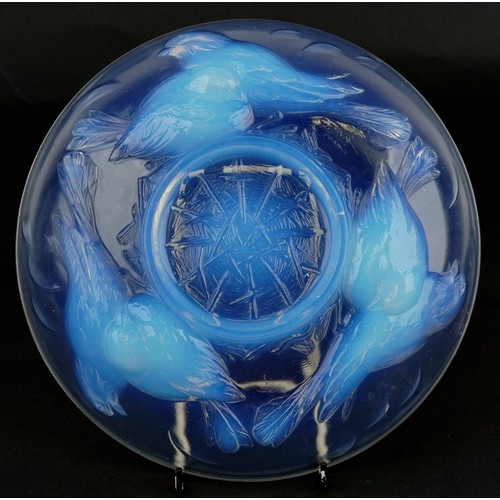  An Ezan France opalescent pressed glass bowl decorated with birds, 25cm in diameter.