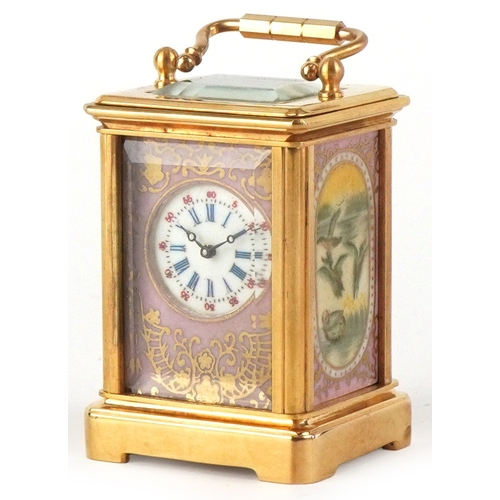 98A - A miniature brass cased carriage clock having Sèvres type panels hand painted with landscapes, the d... 
