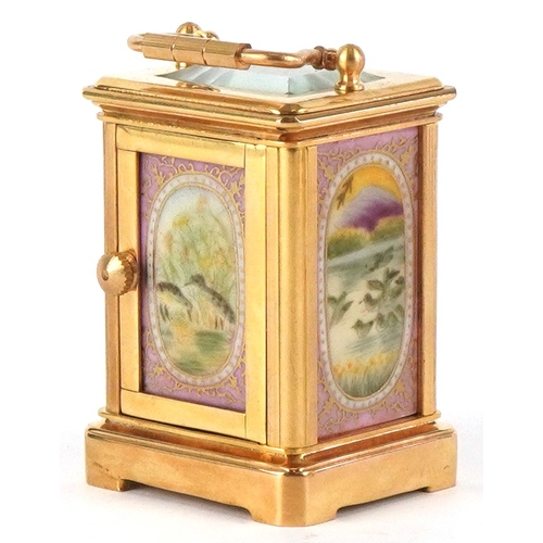 98A - A miniature brass cased carriage clock having Sèvres type panels hand painted with landscapes, the d... 