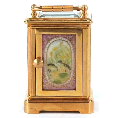 98A - A miniature brass cased carriage clock having Sèvres type panels hand painted with landscapes, the d... 