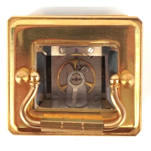 98A - A miniature brass cased carriage clock having Sèvres type panels hand painted with landscapes, the d... 