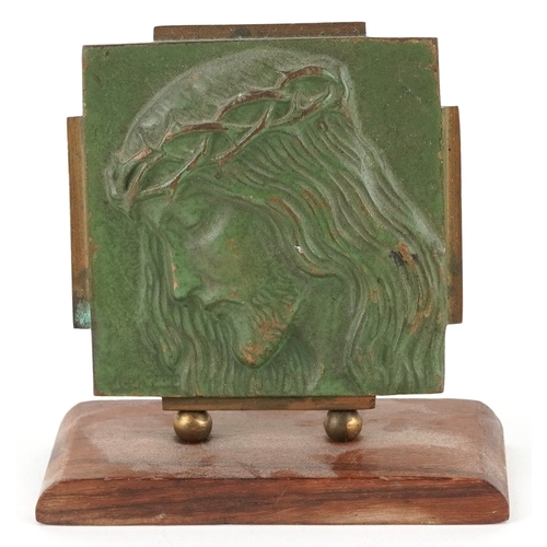 41 - An ecclesiastical verdigris patinated bronze plaque depicting Christ, 9.5cm high.