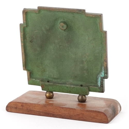 41 - An ecclesiastical verdigris patinated bronze plaque depicting Christ, 9.5cm high.