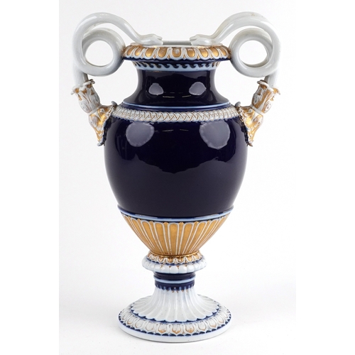  Ernst August Leuteritz for Meissen, a large 19th century German porcelain vase with snake handles an... 