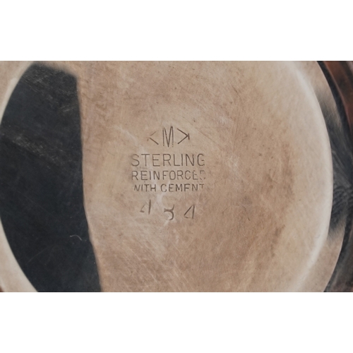  A pair of sterling silver three branch weighted candelabras, 37cm high, total 2452g.