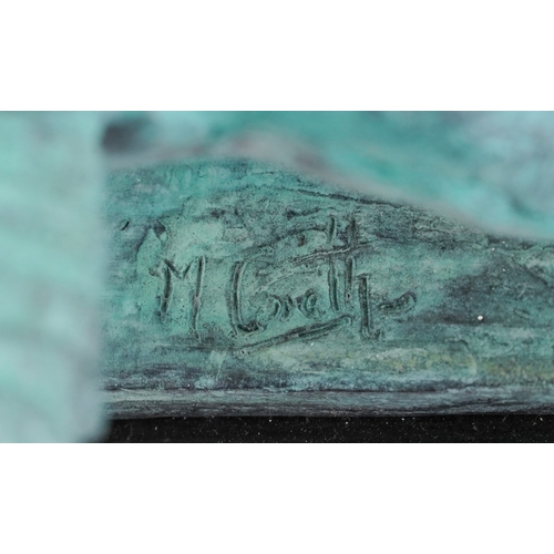 42 - Mark Coreth for McArthur Glen Group, a verdigris bronze figure of a winged lion raised on a black sl... 