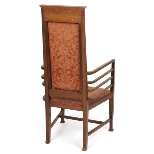  Liberty's Arts & Crafts mahogany high back elbow chair with inlaid decoration, the upholstered drop ... 