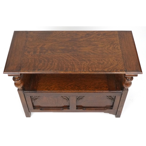  Victorian Gothic Revival oak monk's bench with carved decoration, the box seat above a panelled fron... 