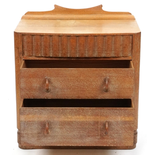  Heals limed oak chest of three drawers, on a plinth base, 83cm H x 74cm W x 45cm D.