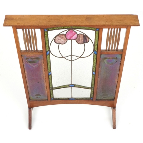  Arts & Crafts oak framed fire screen inset with a leaded stained glass central panel flanked by copp... 