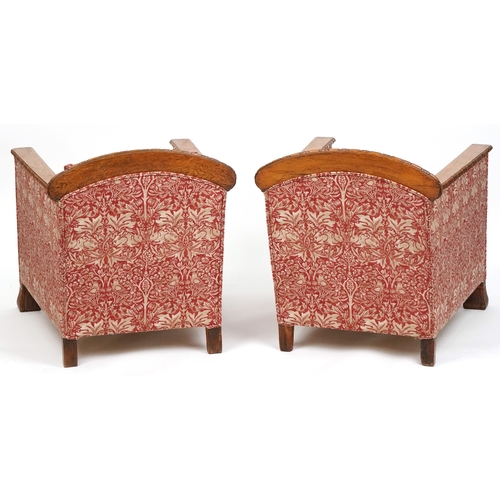  Pair of Arts & Crafts oak framed armchairs with carved decoration, upholstered in Arts & Crafts styl... 