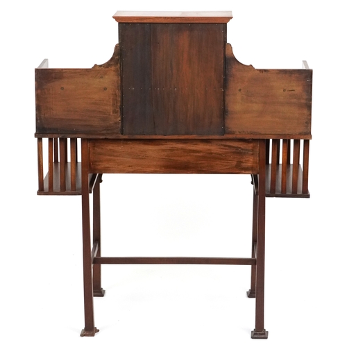  An Arts & Crafts mahogany desk, the shelf back with a leaded glass door above a frieze drawer, raise... 