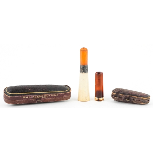 103 - A Meerschaum cheroot holder with amber coloured mouthpiece and silver collar together with an 18ct g... 