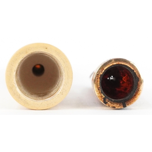 103 - A Meerschaum cheroot holder with amber coloured mouthpiece and silver collar together with an 18ct g... 