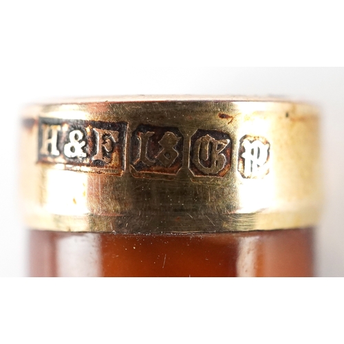 103 - A Meerschaum cheroot holder with amber coloured mouthpiece and silver collar together with an 18ct g... 