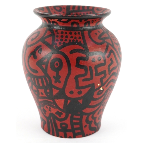 14 - In the manner of Keith Haring, a 20th century terracotta vase with hand painted decoration, 13cm hig... 